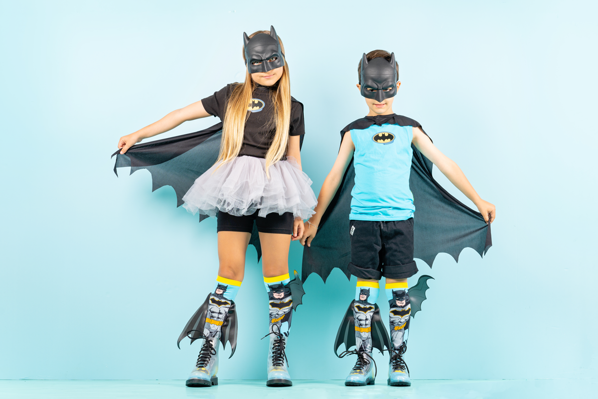 Batman novelty socks with attached 3D bat wings and colorful comic book design.