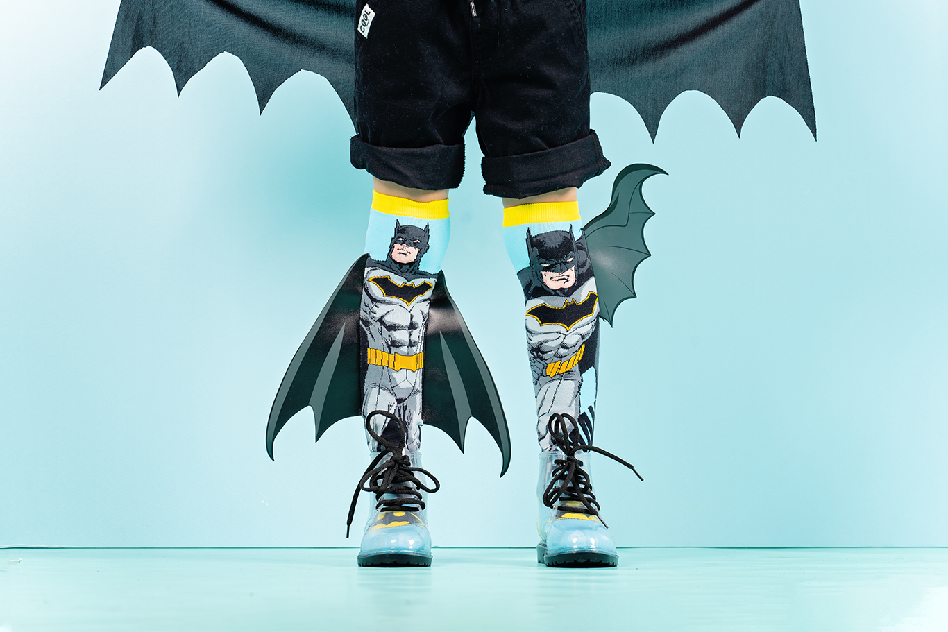 Batman superhero knee high socks with iconic emblem and attached 3D bat wings.