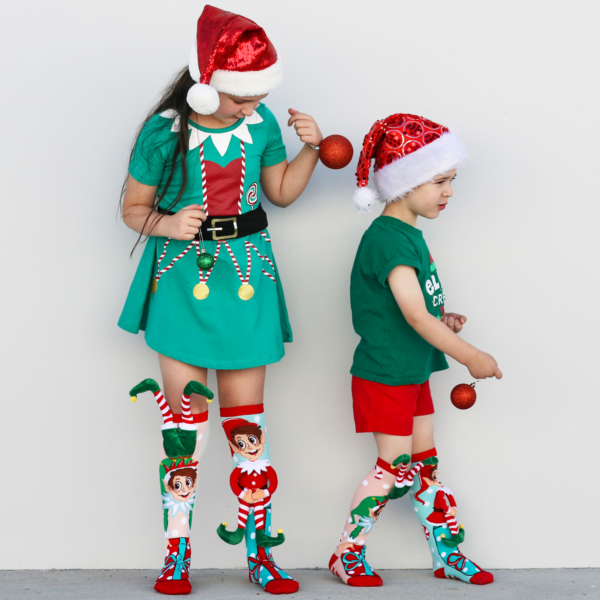 Bright Christmas elf socks with playful plush elf details and fun holiday-inspired design.