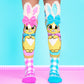 Bunny socks with soft fuzzy ears and velvet bows in pink and blue.