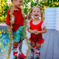 Christmas Wonderland elf socks with colorful festive graphics and soft plush elf details.