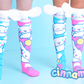 Colorful knee-high socks with cartoon characters on a blue background, featuring the brand 'Cinnamoroll'.