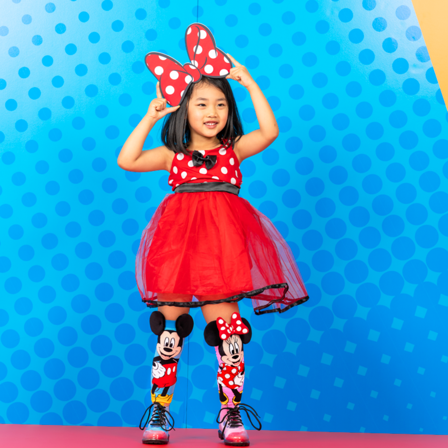 Colorful Disney Mickey and Minnie socks featuring plush ears and classic cartoon character design.