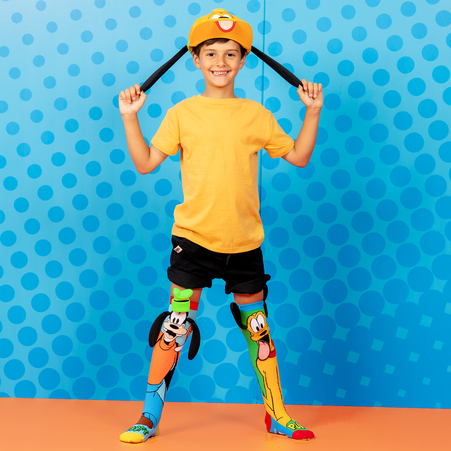 Colorful Pluto and Goofy novelty socks for kids and adults with fun character details and bouncy ears.