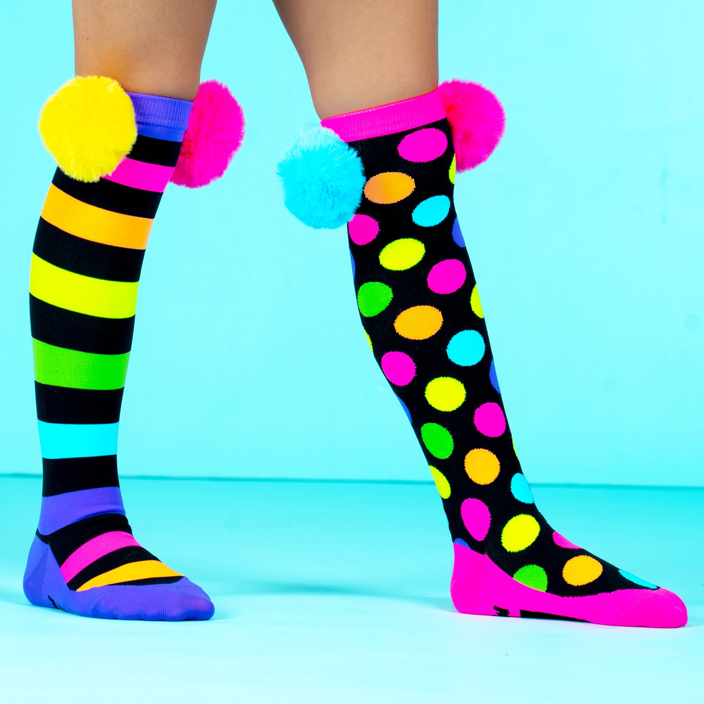 Colorful pom pom character socks with bright colors and soft pom pom details for fun everyday wear.