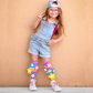 Colorful spring flower socks featuring playful floral graphics and soft plush flower accents.