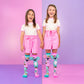 Two children wearing colorful koala knee high socks with plush ears and floral character artwork.