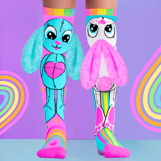 Cute rainbow bunny character socks with bright colors, soft 3D ears, and fun playful design for kids.