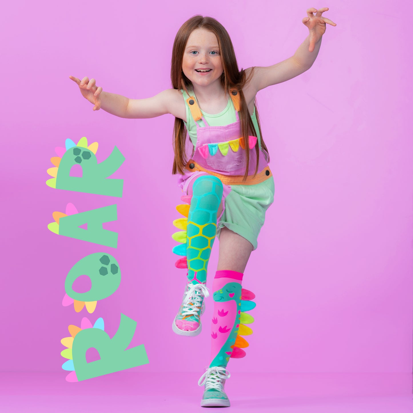 Dinosaur character socks for kids with bright colors, playful patterns, and soft plush spikes.