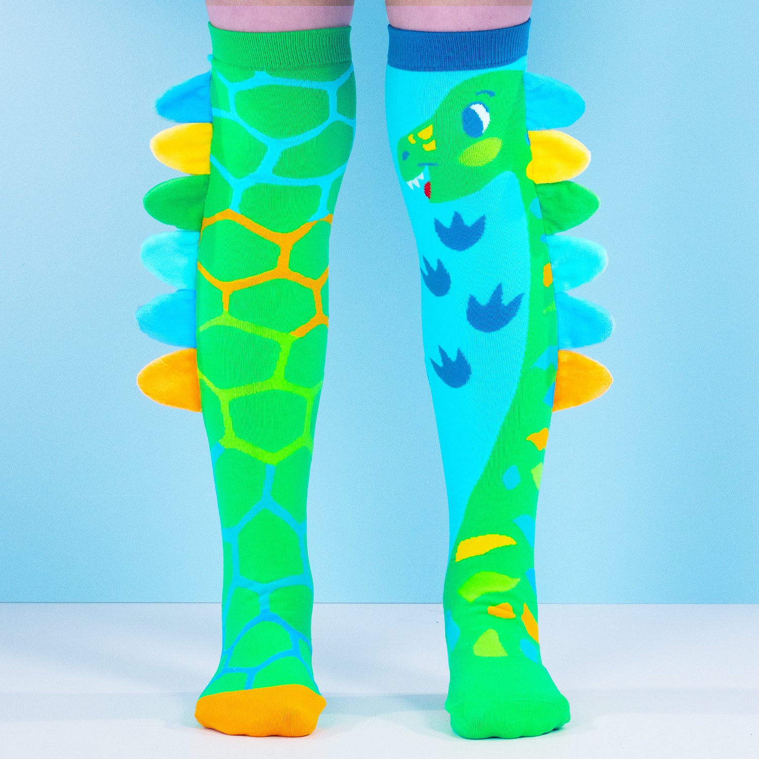 Fun novelty socks featuring dinosaur scales and soft 3D spine details
