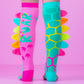 Colorful dinosaur knee high socks for kids and adults with vibrant patterns and plush spikes design.
