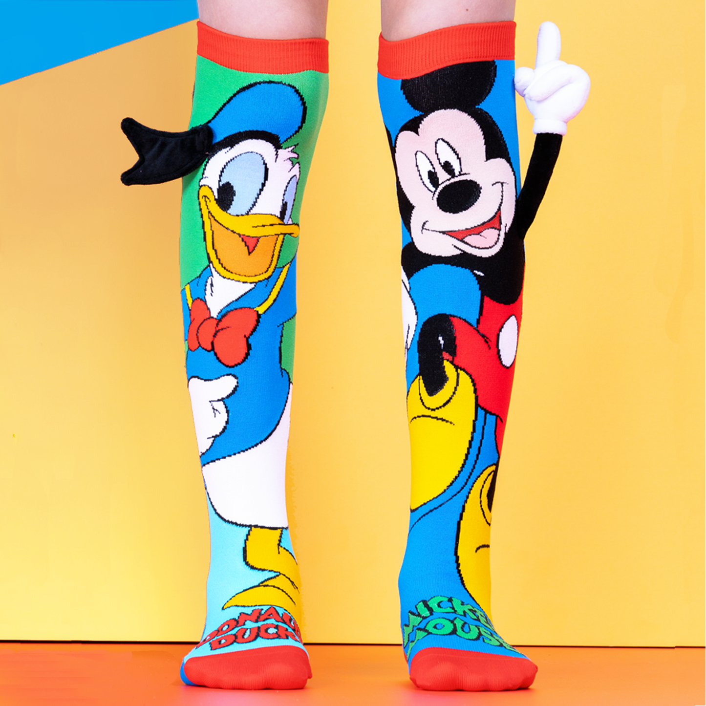 Disney Mickey and Donald knee high socks featuring colorful character design and playful 3D details.