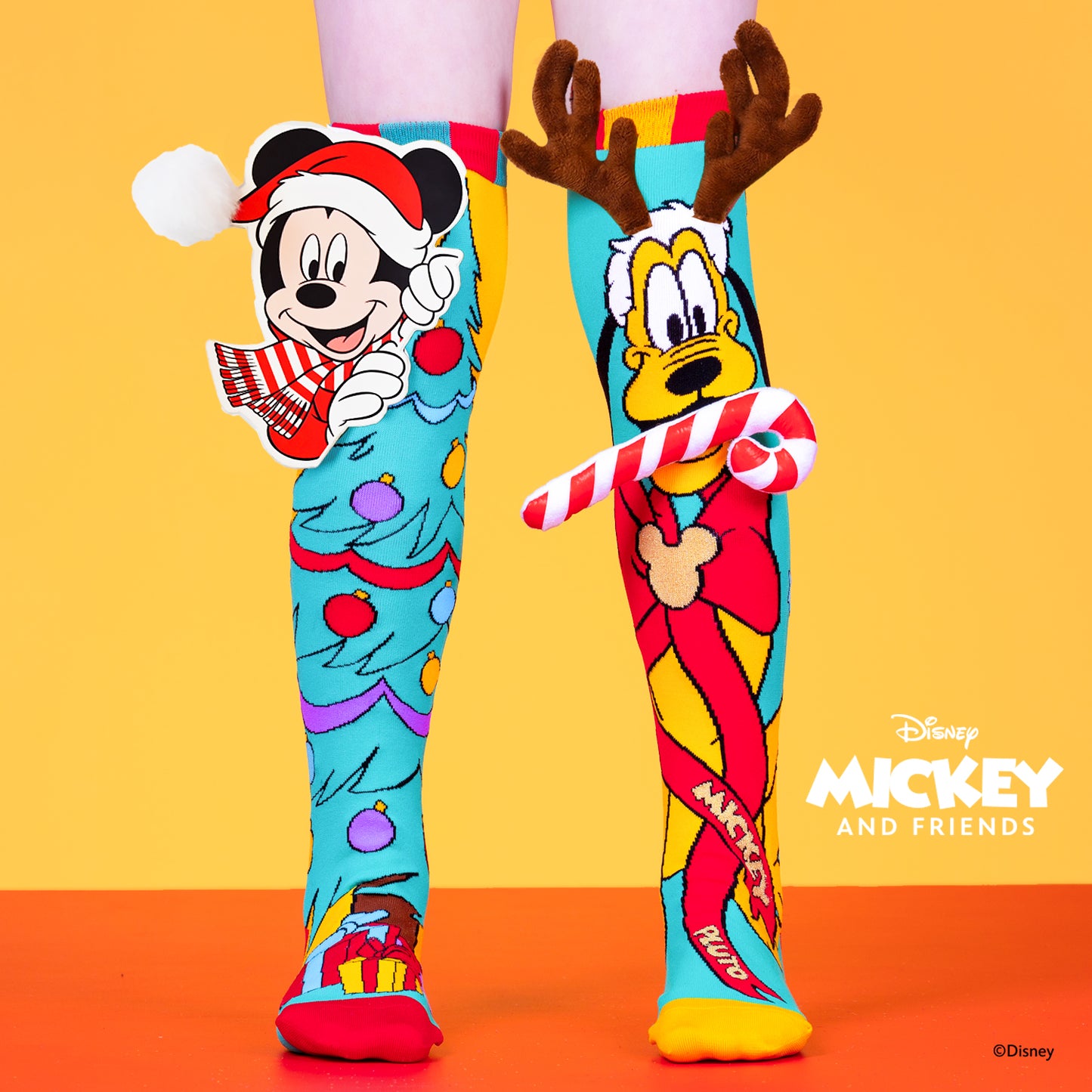 Disney Mickey and Pluto Christmas knee high socks featuring festive holiday design and colorful character graphics.