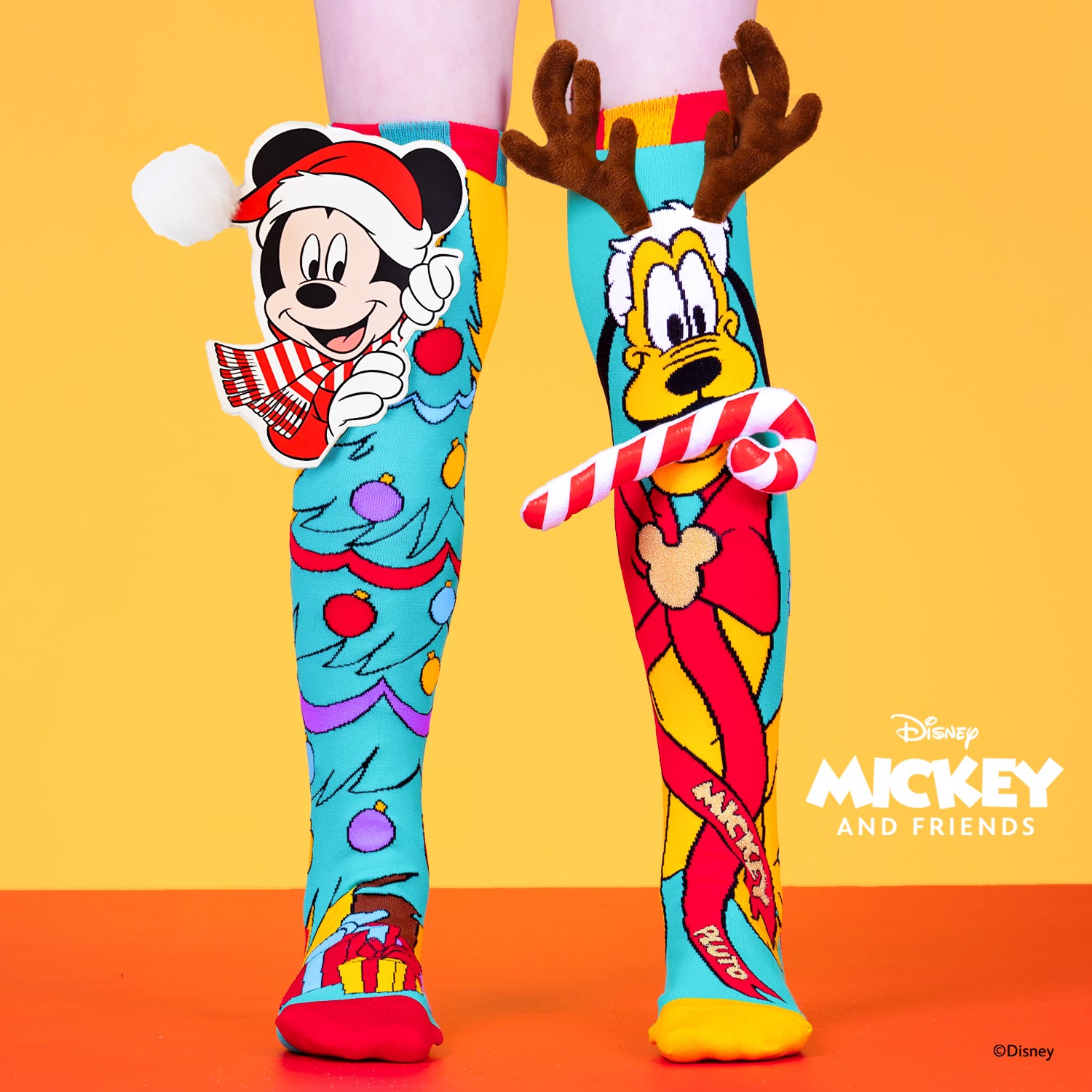 Disney Mickey and Pluto Christmas knee high socks featuring festive holiday design and colorful character graphics.