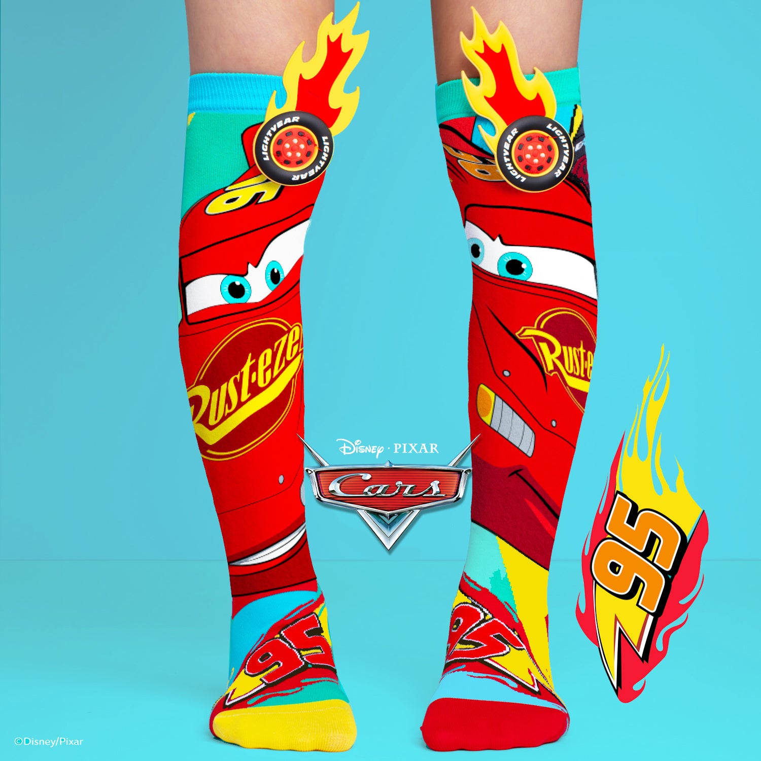 Disney Pixar Cars knee high socks featuring Lightning McQueen artwork with 3D wheel and flame details.