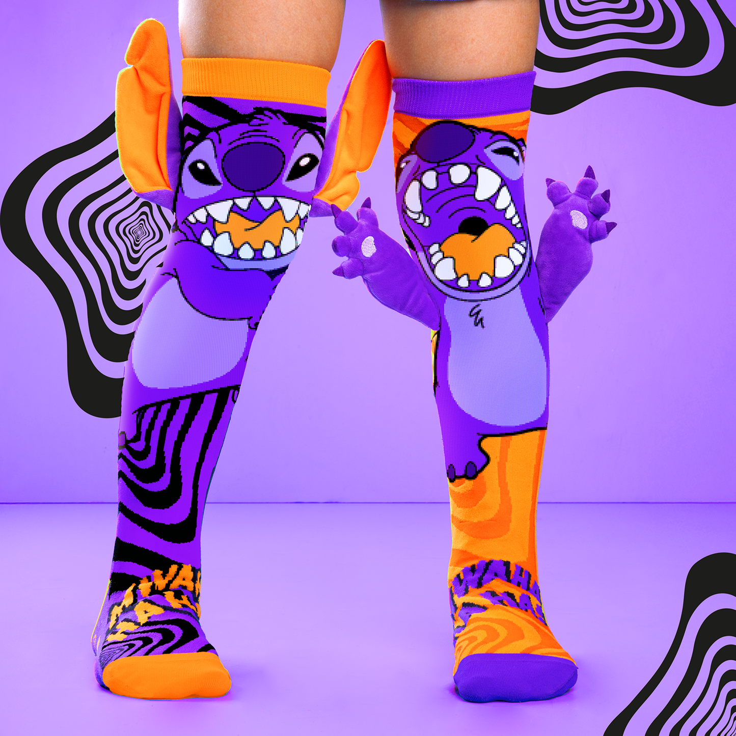 Disney Stitchzilla Halloween socks with neon purple monster graphics, orange accents, and 3D plush arms and ears.