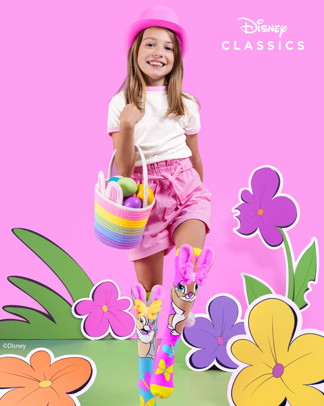 Child wearing Disney Thumper bunny knee high socks featuring plush ears, butterfly bows and colorful spring designs.