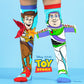 Disney Toy Story knee high socks featuring Woody and Buzz Lightyear in colorful character design.