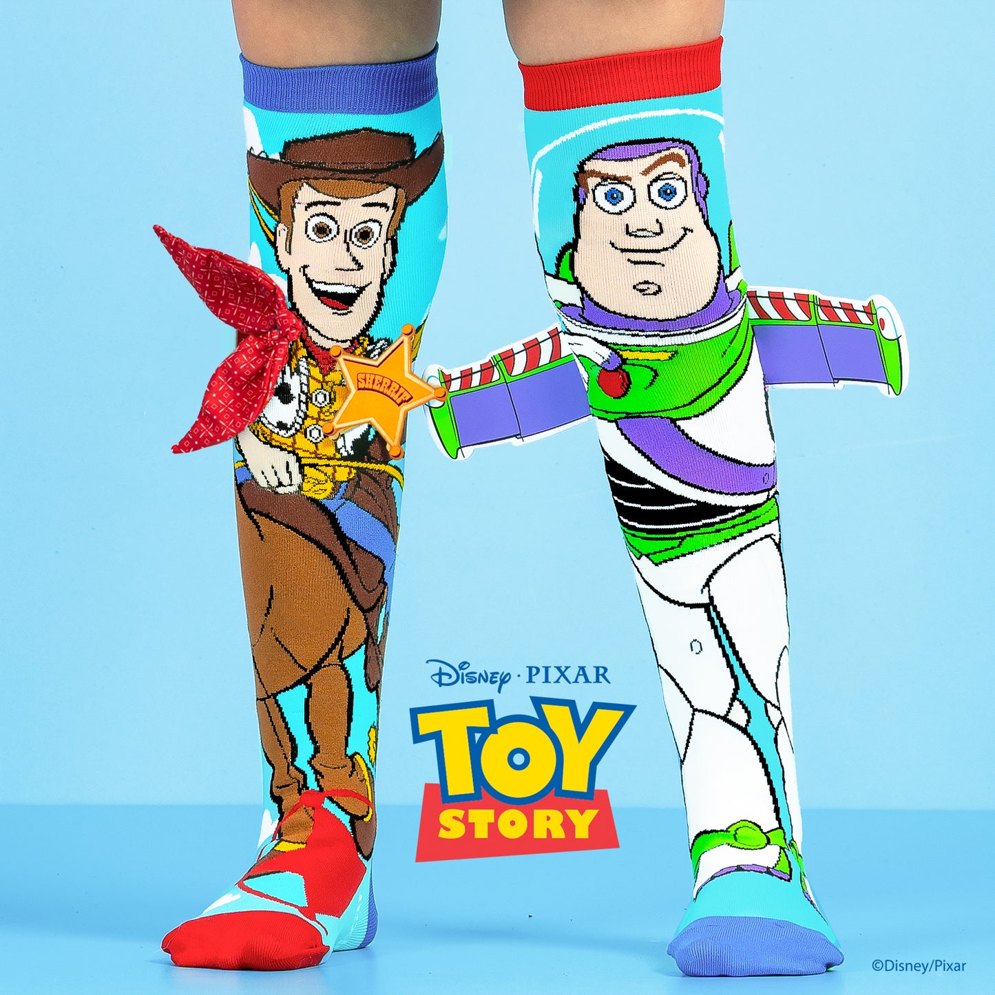 Disney Toy Story knee high socks featuring Woody and Buzz Lightyear in colorful character design.
