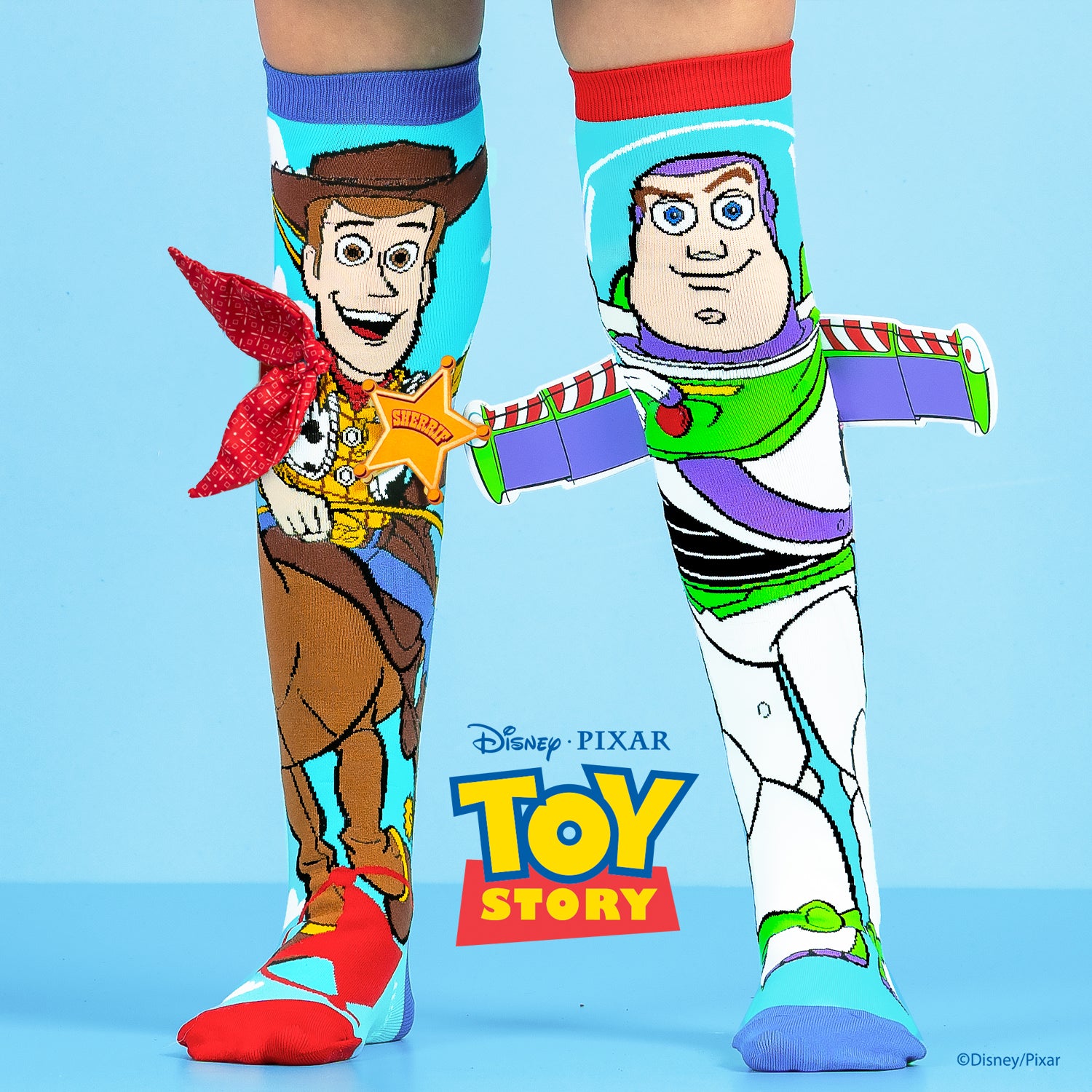 Disney Toy Story knee high socks featuring Woody and Buzz Lightyear in colorful character design.