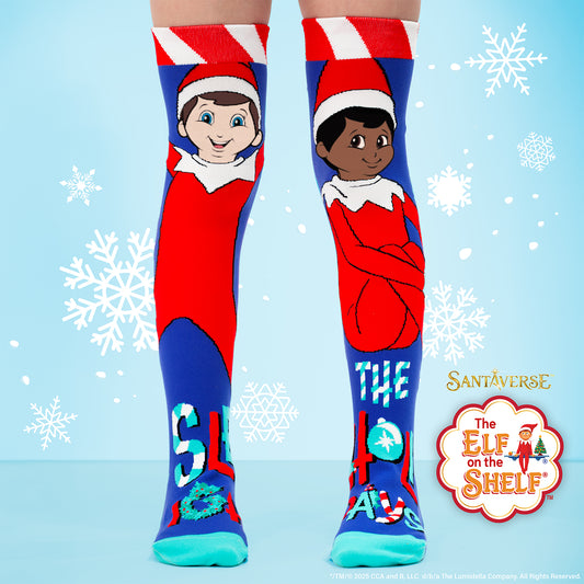 Elf on the Shelf knee high socks featuring festive character design with bright Christmas colors for kids and adults.