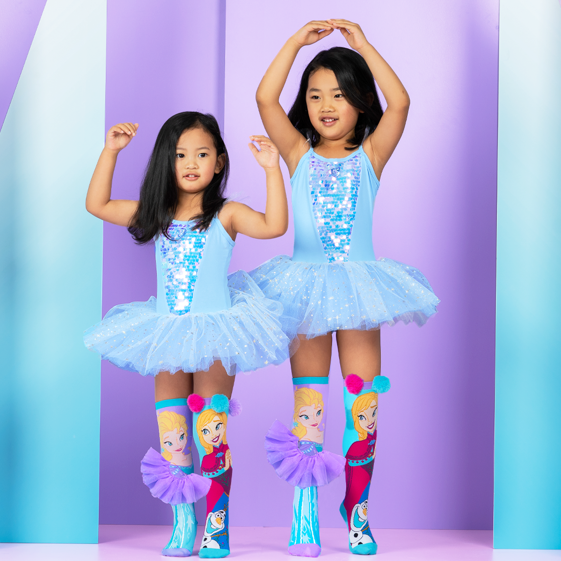 Elsa and Anna character socks featuring custom 3D skirt details and bright Frozen-inspired colors.