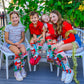 Festive elf socks for kids and adults featuring playful Christmas design and plush elf characters.