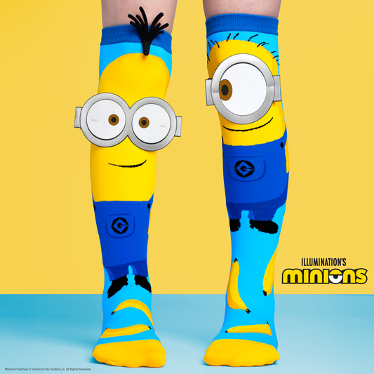 Cartoon Minions socks for kids with oversized goggles graphics and playful design.