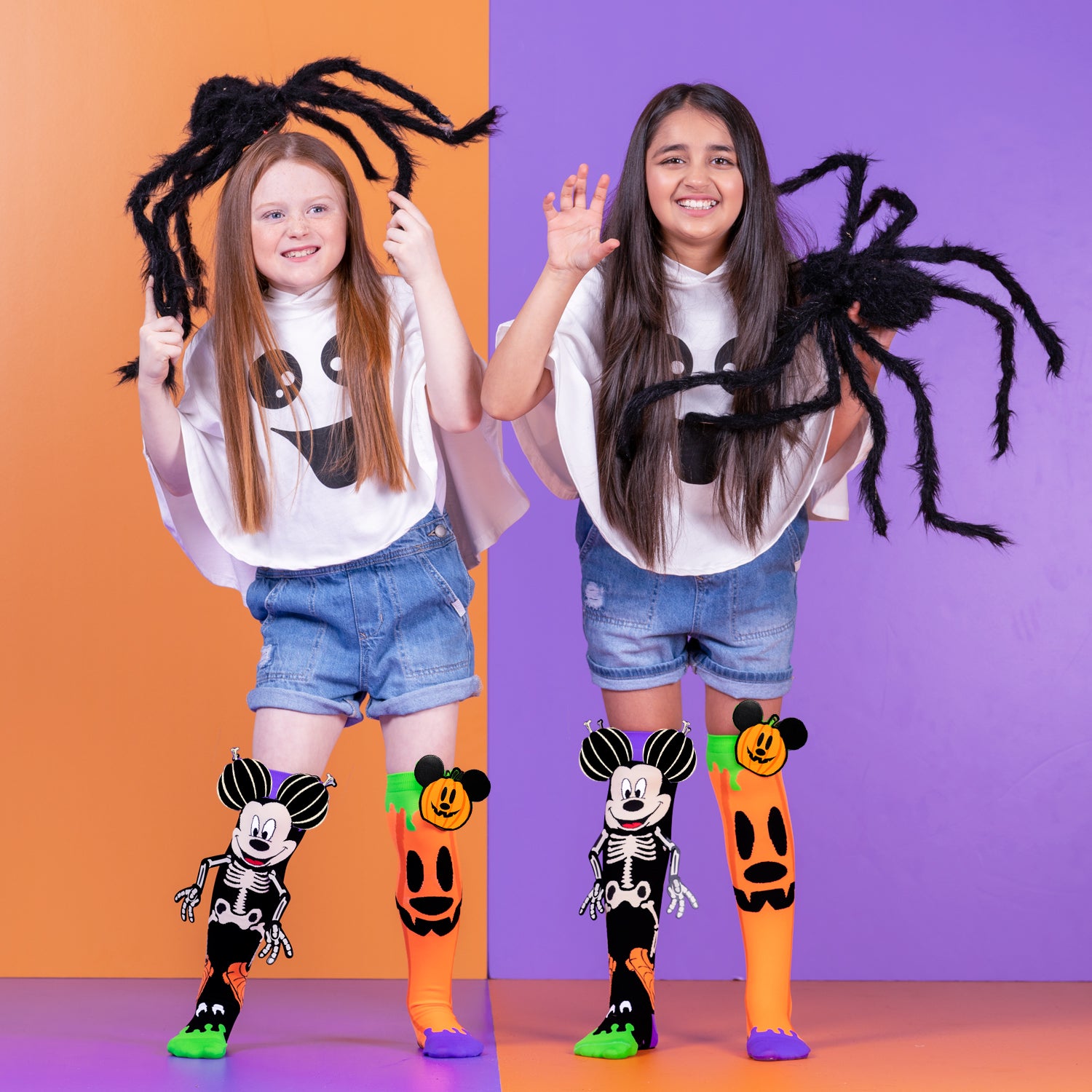 Glow in the dark Mickey Halloween character socks featuring skeleton graphics and festive pumpkin design.