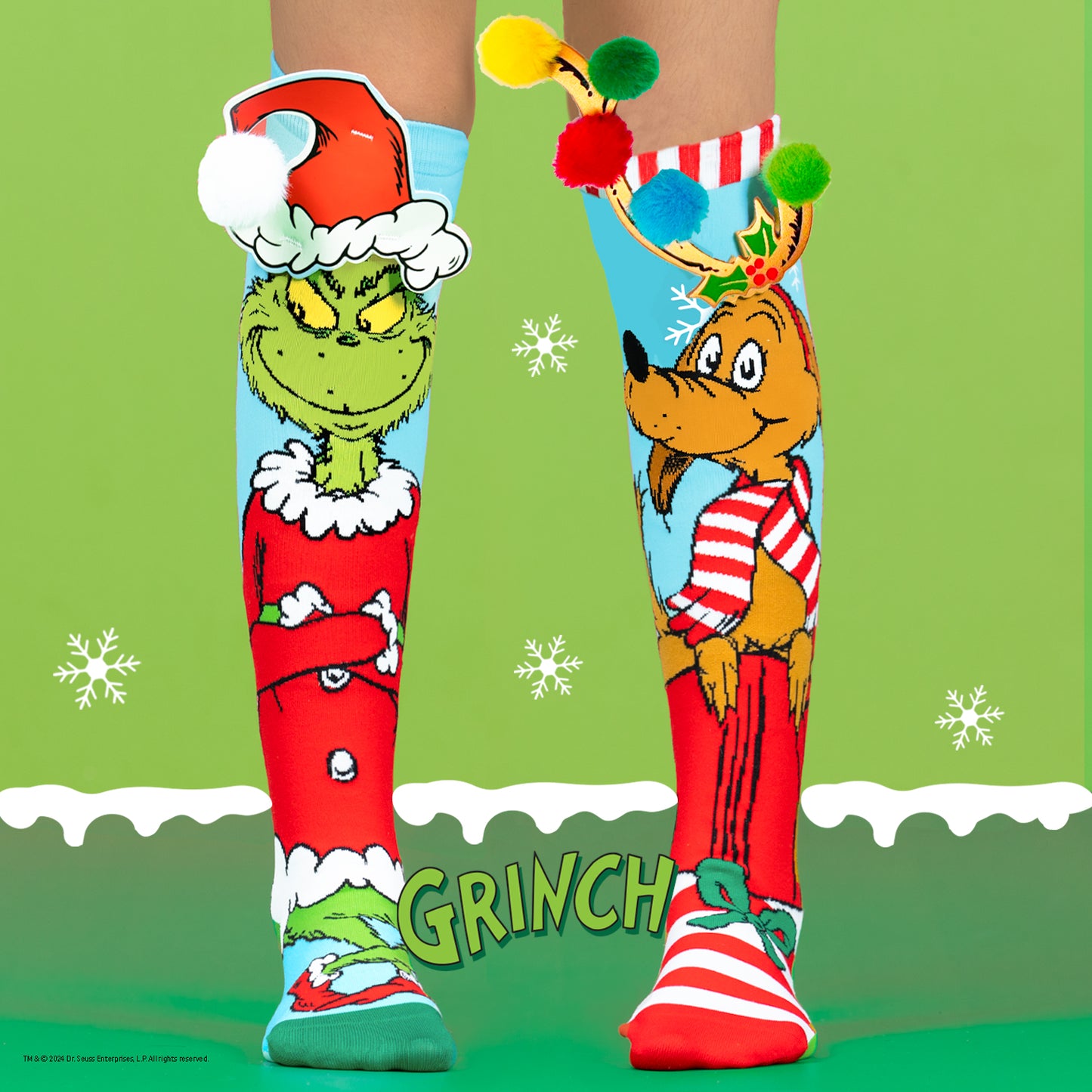 Grinch character novelty socks with bright colors and fun Christmas-themed graphics for kids and adults.