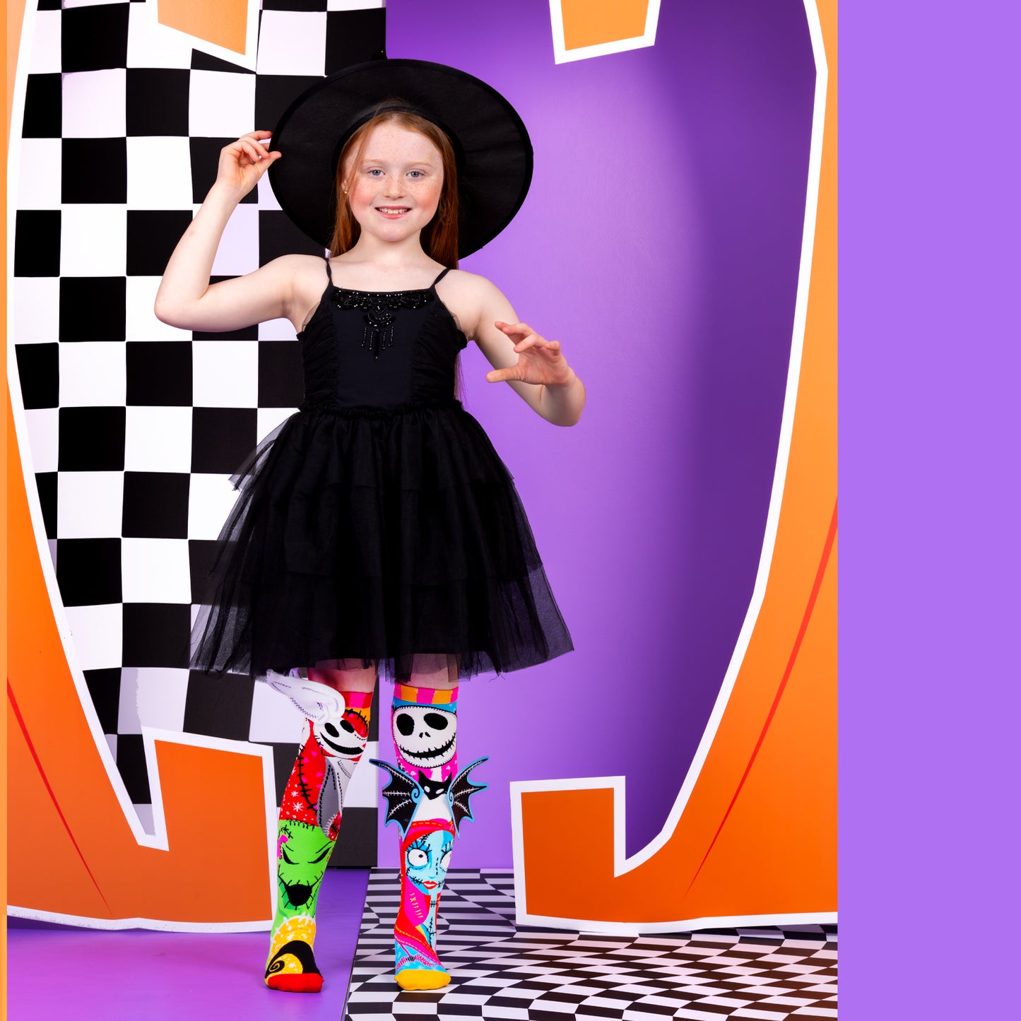 Girl wearing Disney Nightmare Before Christmas knee high socks featuring Jack Skellington and Sally characters
