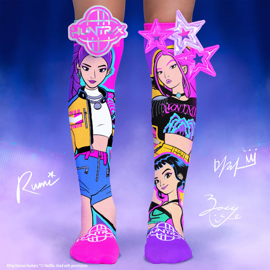 KPop Demon Hunters knee high socks featuring colorful Netflix character artwork and star accessories.