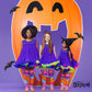 Three kids wearing purple Halloween costumes styled with Disney Stitch neon trick or treat knee high socks.
