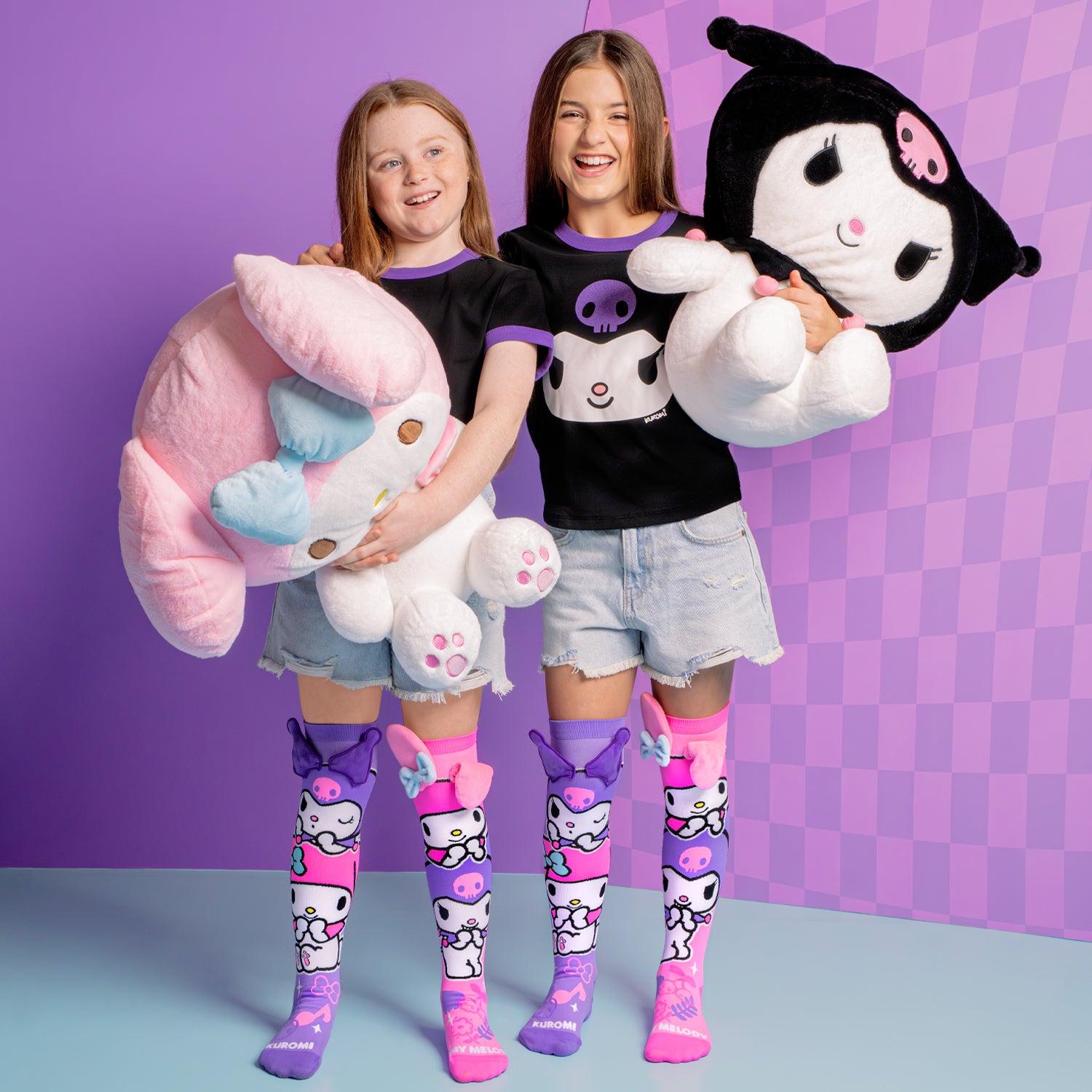 Cute novelty socks with Kuromi and My Melody character artwork and plush accents