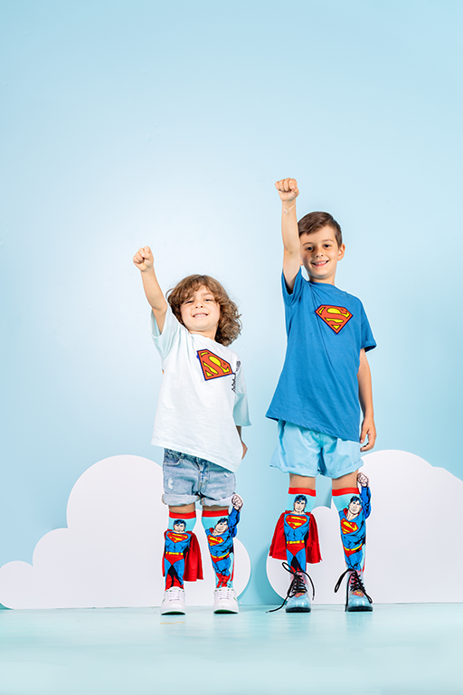 Kids Superman socks featuring velvet cape, embroidered logo, and playful 3D superhero details.