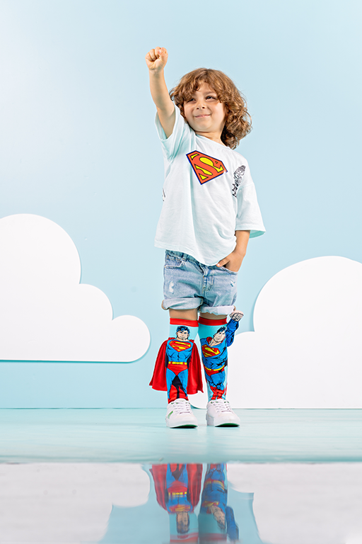 DC Comics Superman socks with soft velvet cape and iconic superhero emblem design.