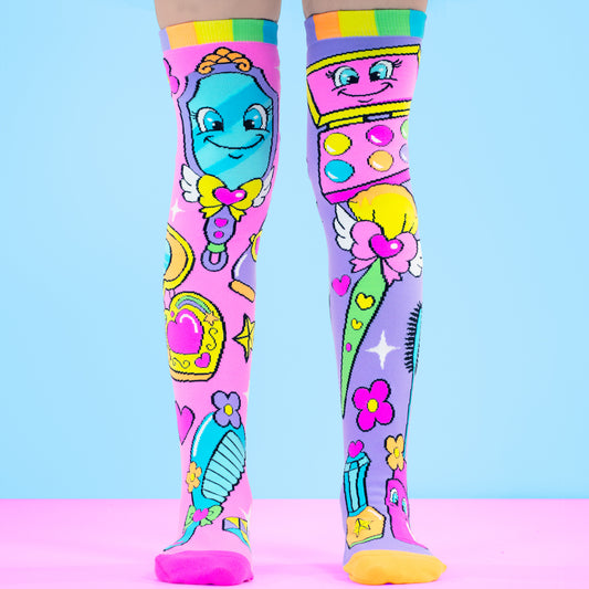 Makeup knee high socks for kids featuring smiling makeup brushes, mirrors, and colorful beauty accessories design.