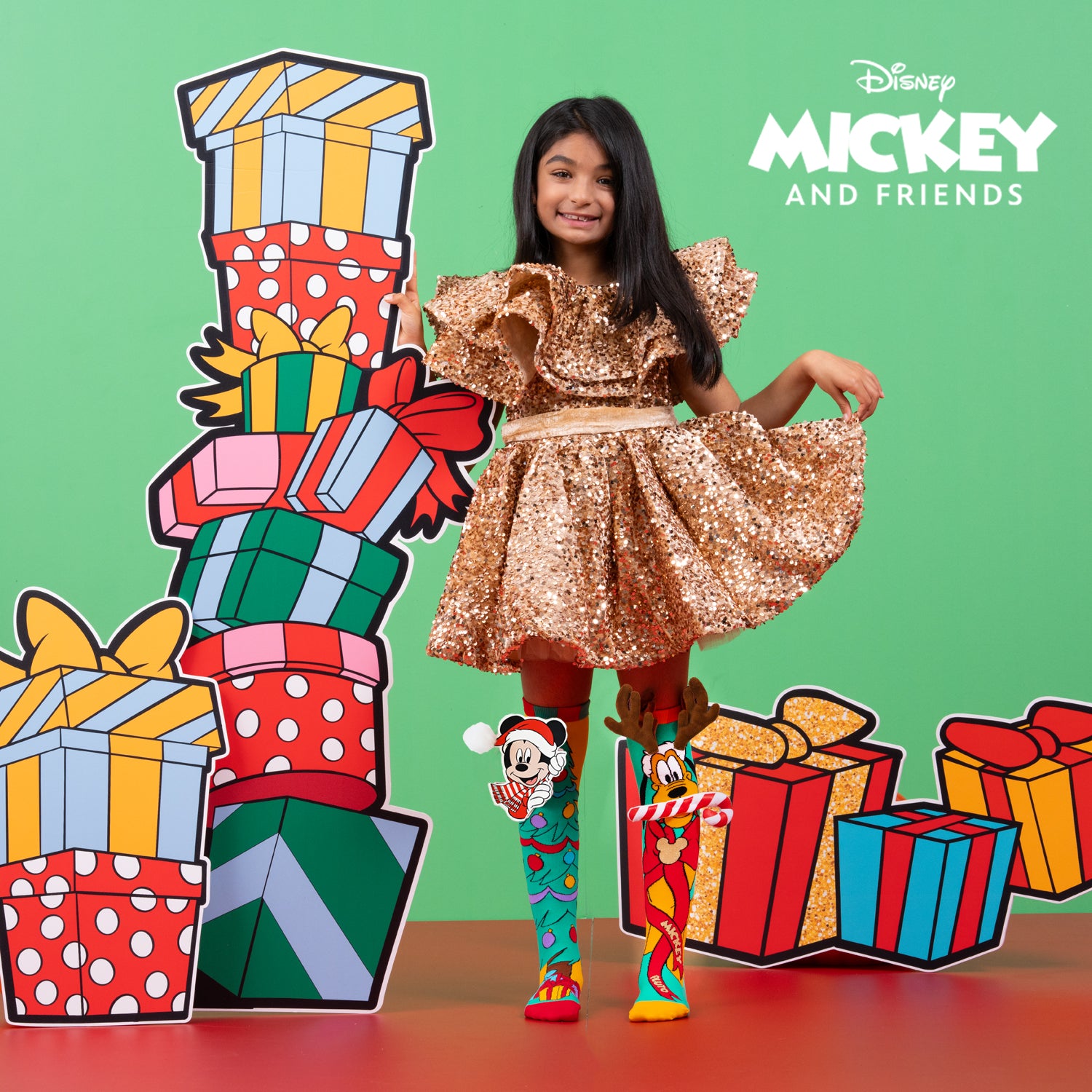 Mickey Christmas socks featuring Santa hat, scarf, and plush pom pom detail with festive holiday colors.