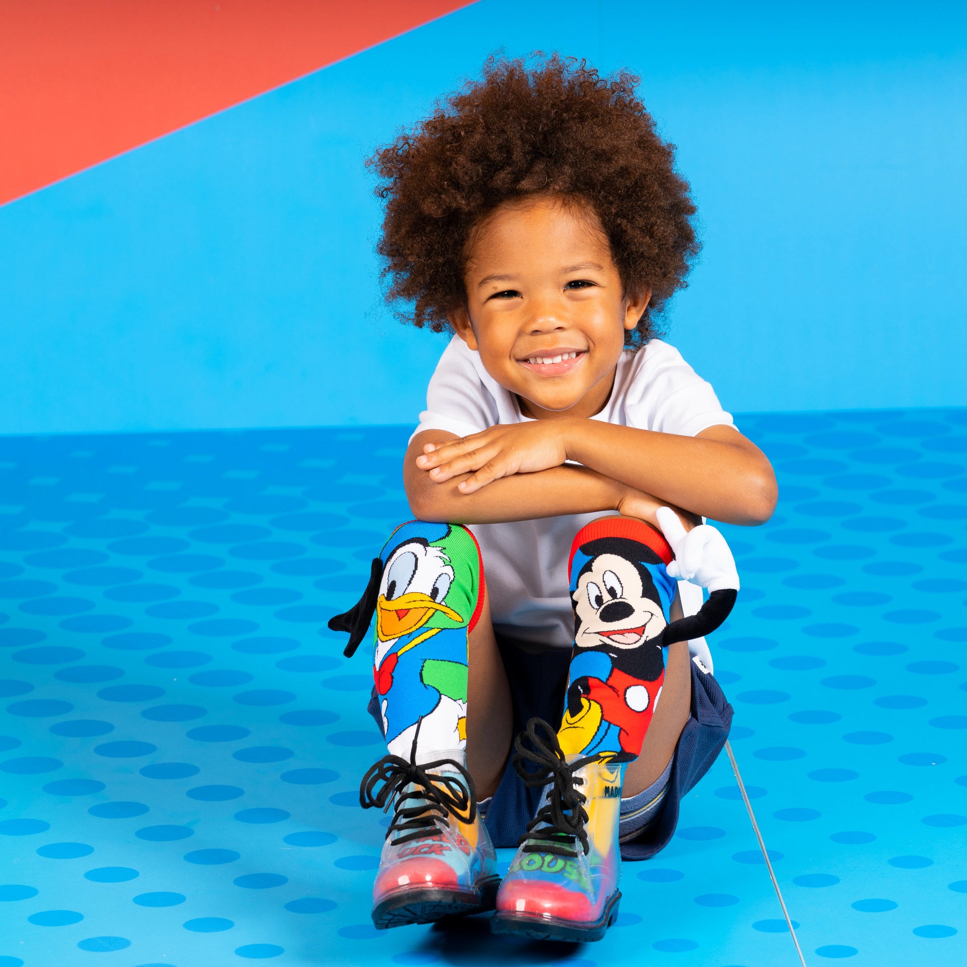 Mickey Mouse and Donald Duck character socks with bright colors and fun cartoon design.