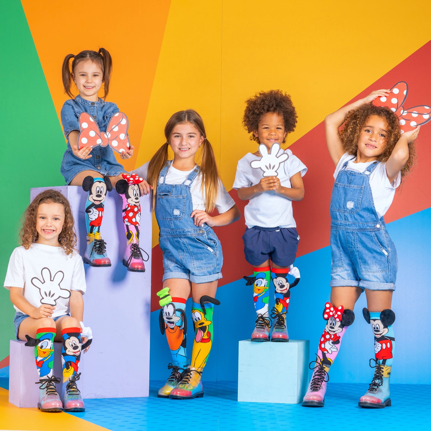 Mickey and Donald novelty socks with bright colors and fun 3D character features.