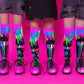 Bright neon MADMIA slime socks with colorful gooey patterns glowing under UV light for fun party outfits.