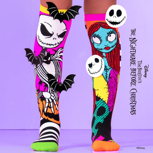 Nightmare Before Christmas knee high socks featuring Jack Skellington and Sally in spooky Halloween design.