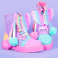 Rainbow glitter boots for kids and adults featuring colorful butterfly wings and pom pom lace details.