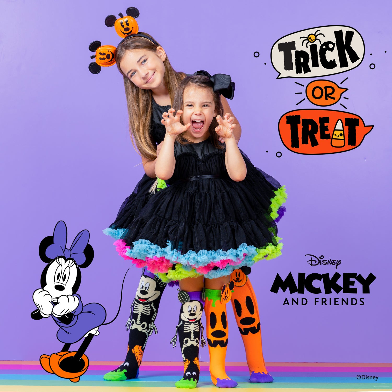 Spooky Disney Mickey Halloween knee high socks with skeleton design and colorful pumpkin details.