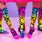 Star and heart knee high socks for kids featuring playful colorful graphics and bright neon details.
