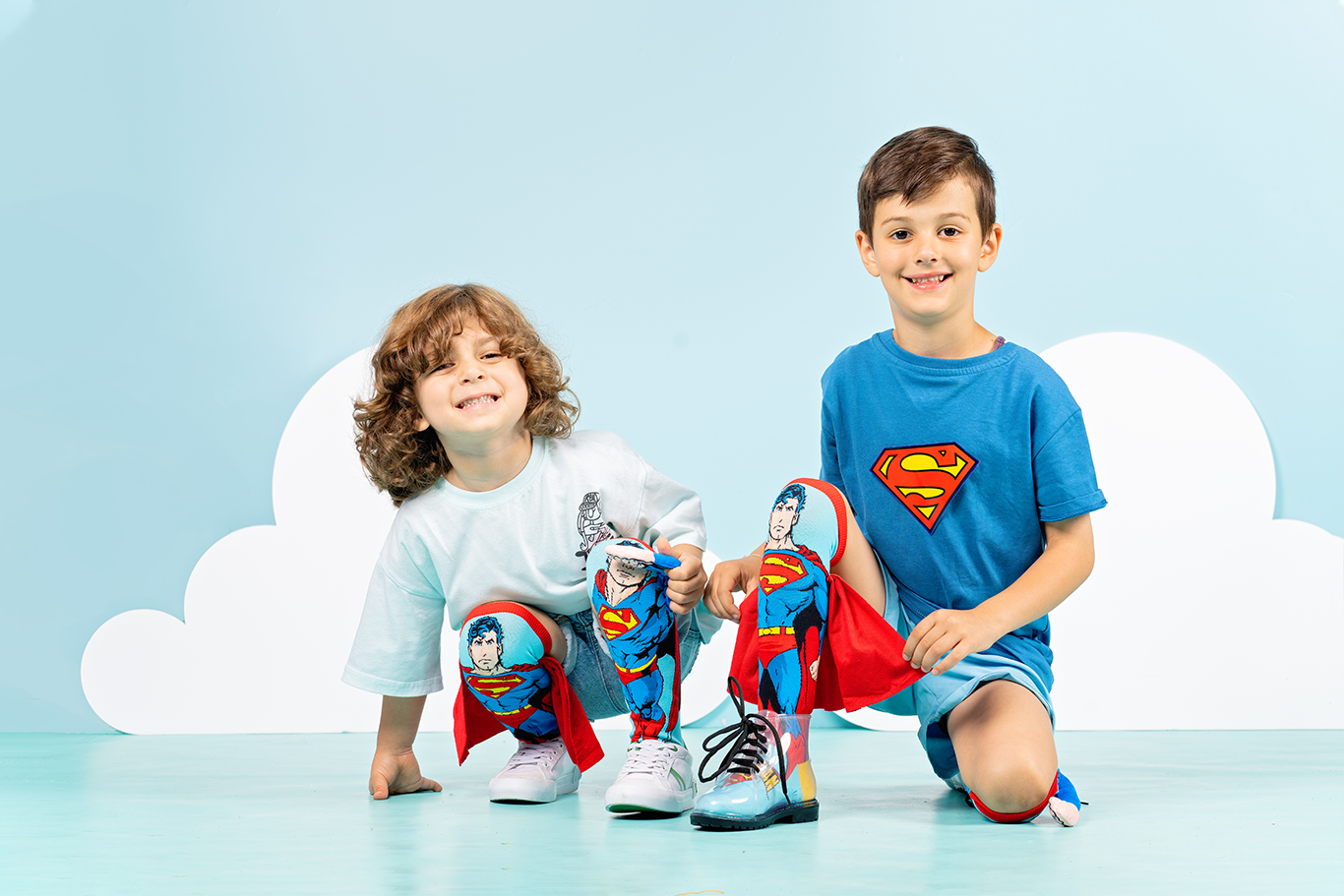 Superhero Superman socks featuring embroidered logo on cape, plush arm, and bold colorful design.