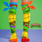 Teenage Ninja Turtles knee high socks featuring Leonardo, Michelangelo, Raphael and Donatello character graphics with colorful 3D bandanas.