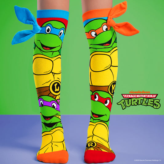 Teenage Ninja Turtles knee high socks featuring Leonardo, Michelangelo, Raphael and Donatello character graphics with colorful 3D bandanas.
