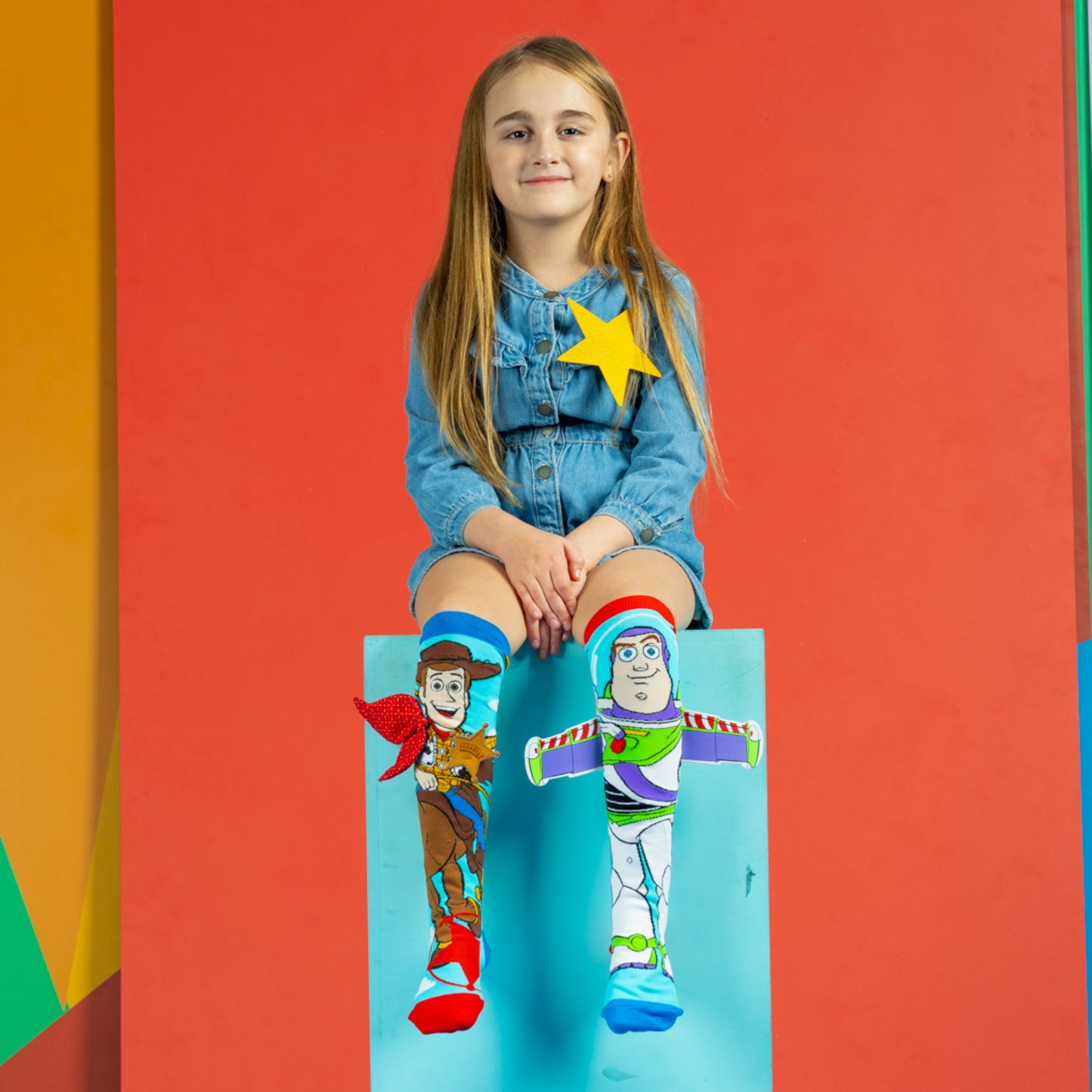 Woody and Buzz Lightyear character socks with bright colors and 3D wings detail on Buzz.