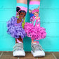 Fashionista Barbie socks featuring colorful patterns and attached 3D tutu skirts.